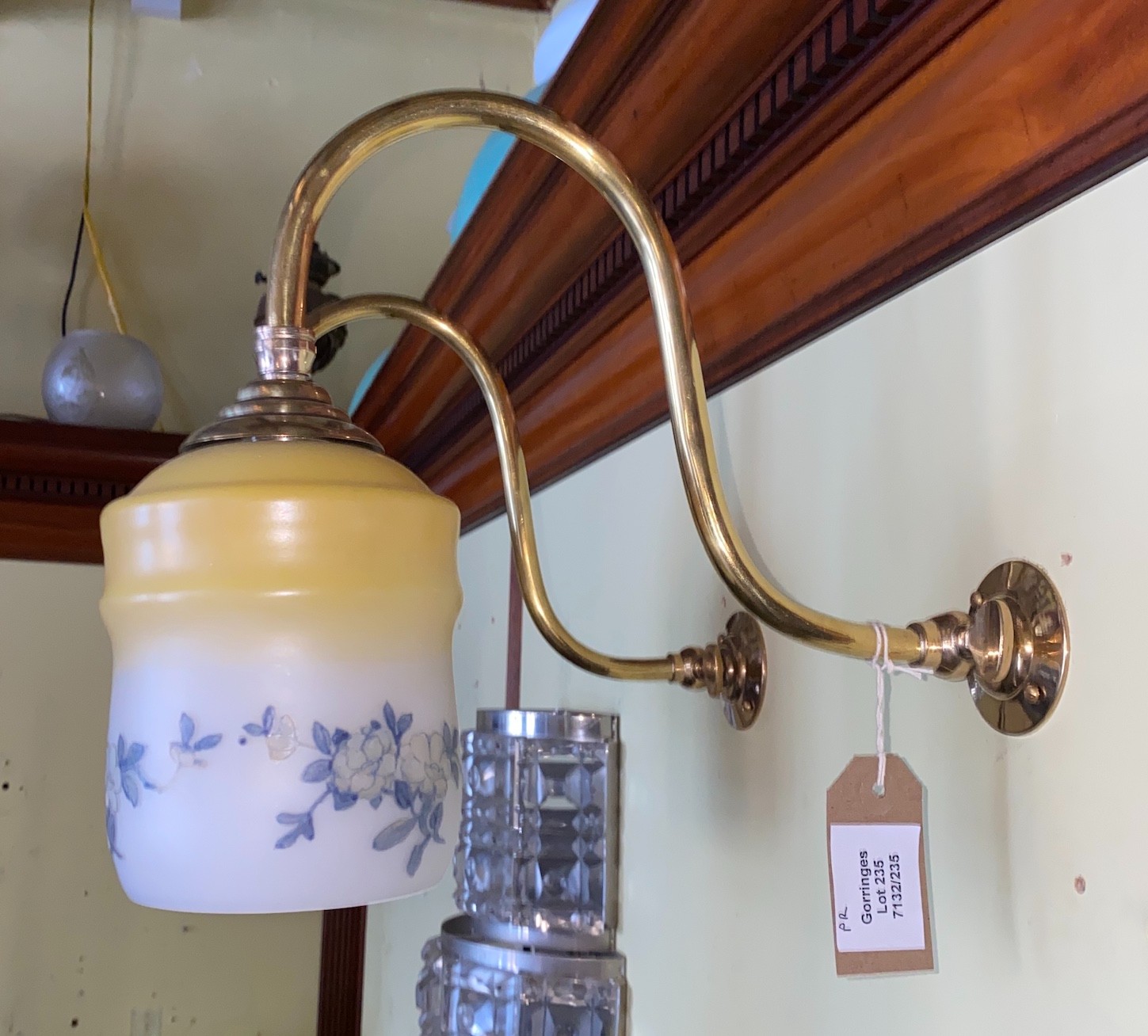 A pair of English brass gasolier wall lights with floral painted opaque wall glass shades, height 26cm